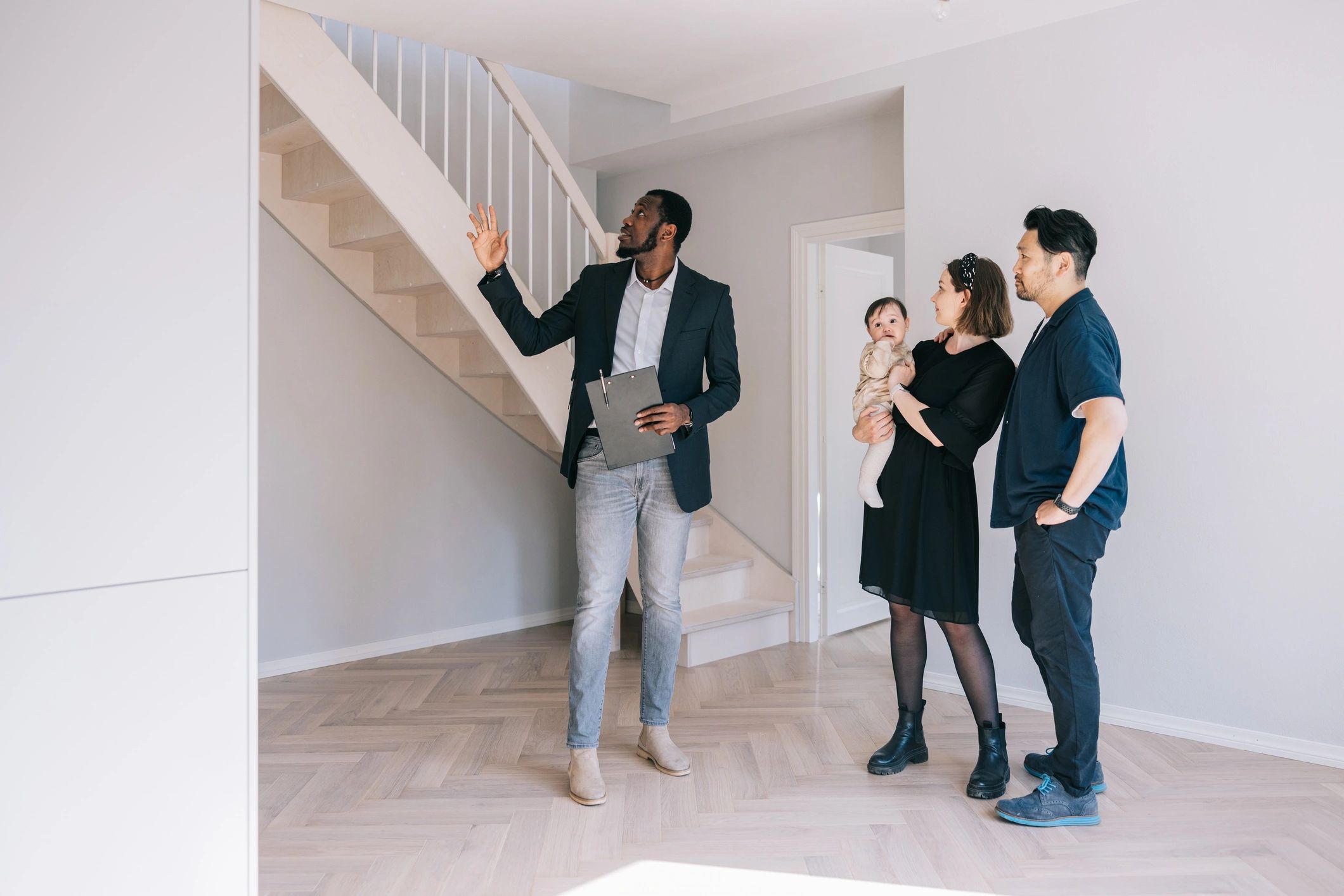Property manager guiding clients through a rental property