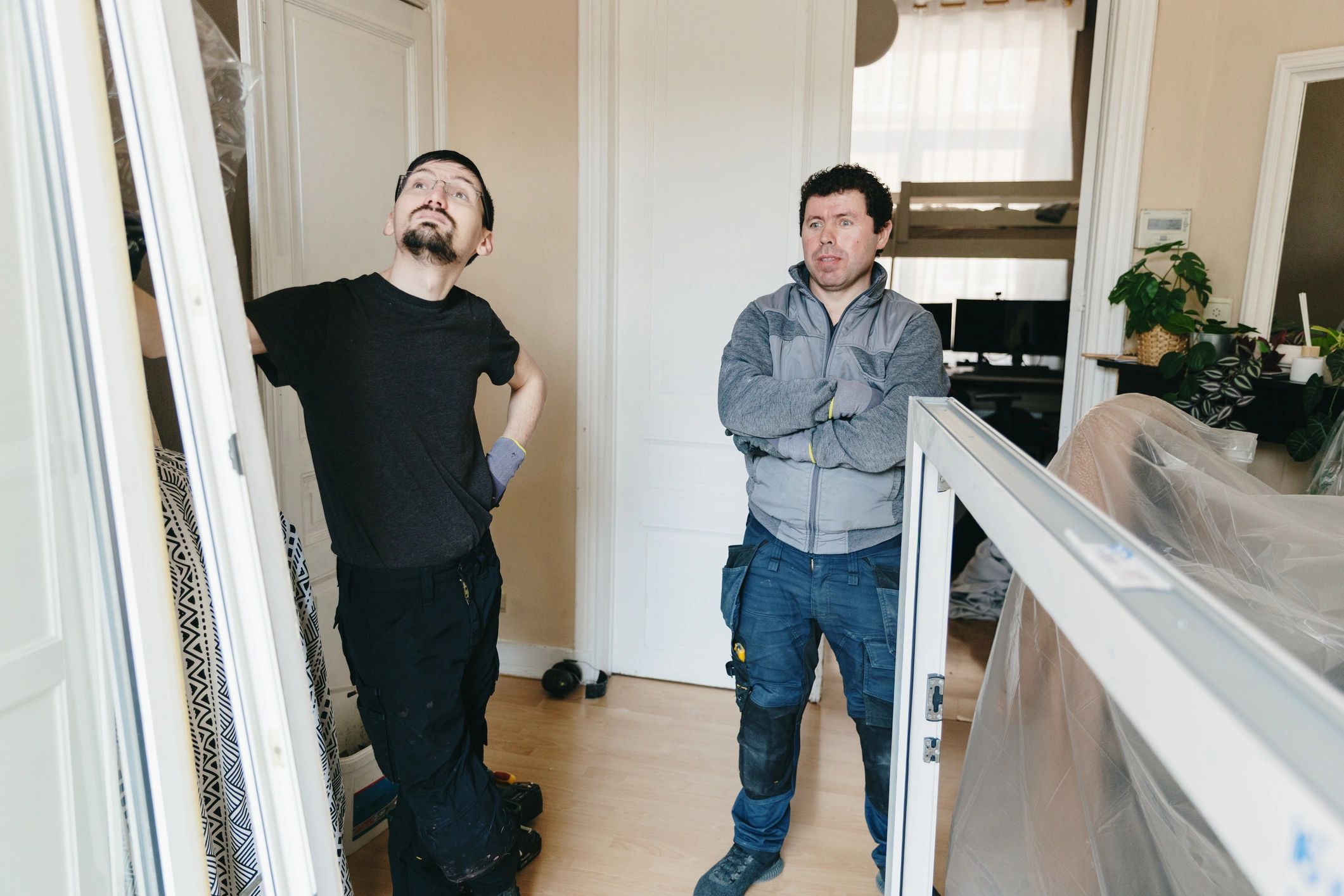 Maintenance team reviewing work inside a residential property